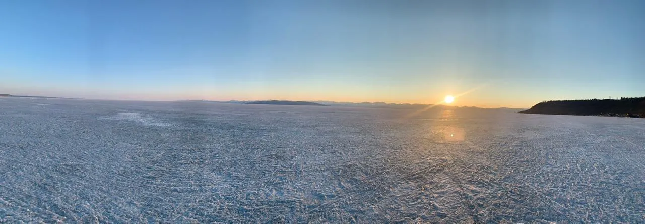 Sunset across a frozen Mongolian lake, the country at first glimpse.